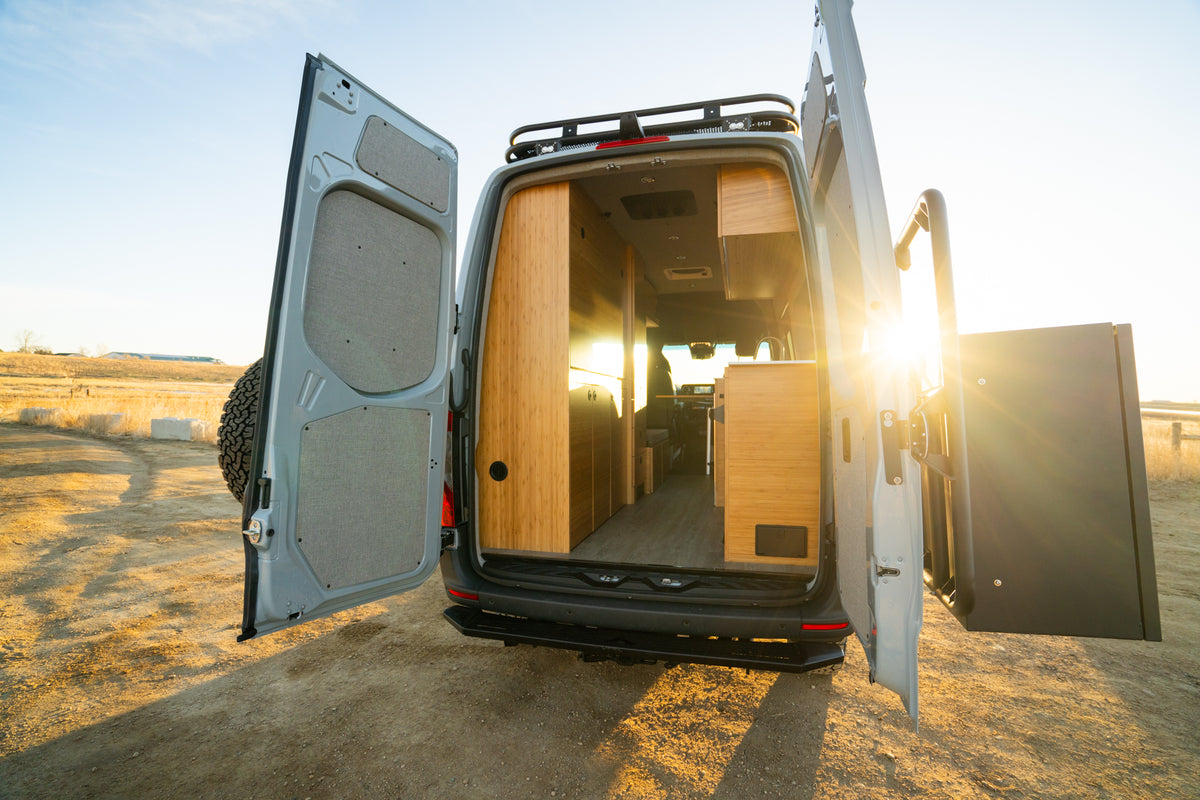 Rear doors open on a Rossmönster build at sunset