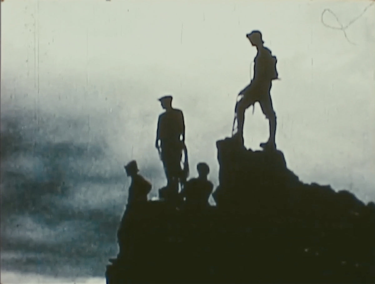 Silhouettes on a summit in cloud